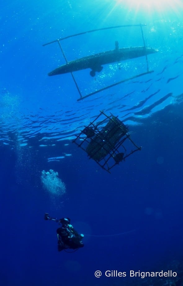 Canoe, fisherman and diver at Alor Divers Resort