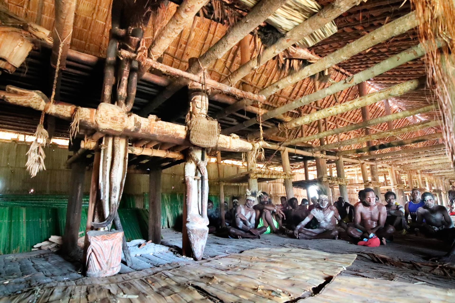 Asmat carved poles veneration ancestors