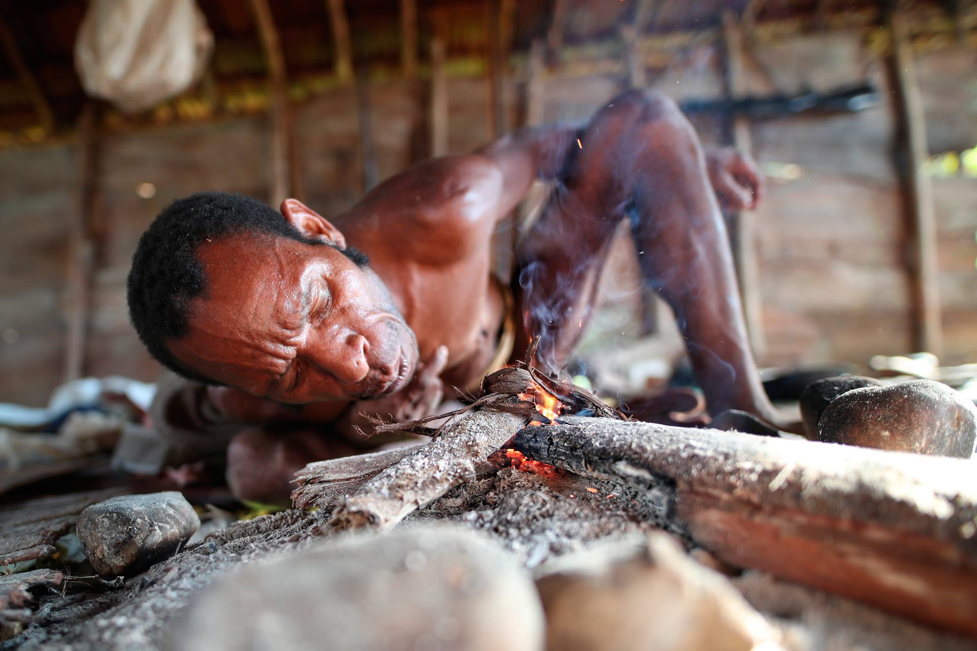 Korowai man lightning fire