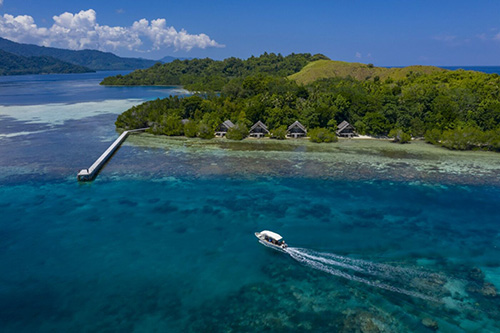 Jetty and speed boat at Kusu Resort, Halmahera