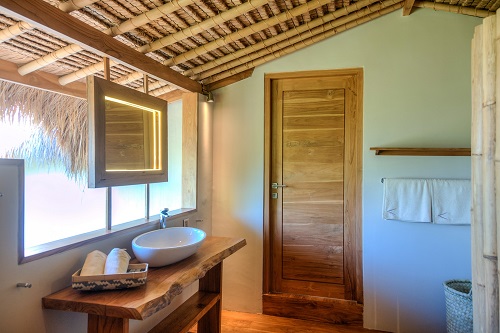 Semi-open bathroom of beach cottage at Savu South Alor